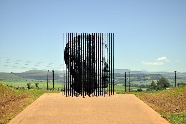 Take a selfie at the world renowned sculpture of Nelson Mandela at the Nelson Mandela Memorial